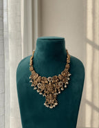 Gold-Plated Temple Jewelry Set with Lakshmi Necklace and Jhumka Earrings – Antique Finish Ruby & Emerald Bridal Jewelry for Weddings & Festivals