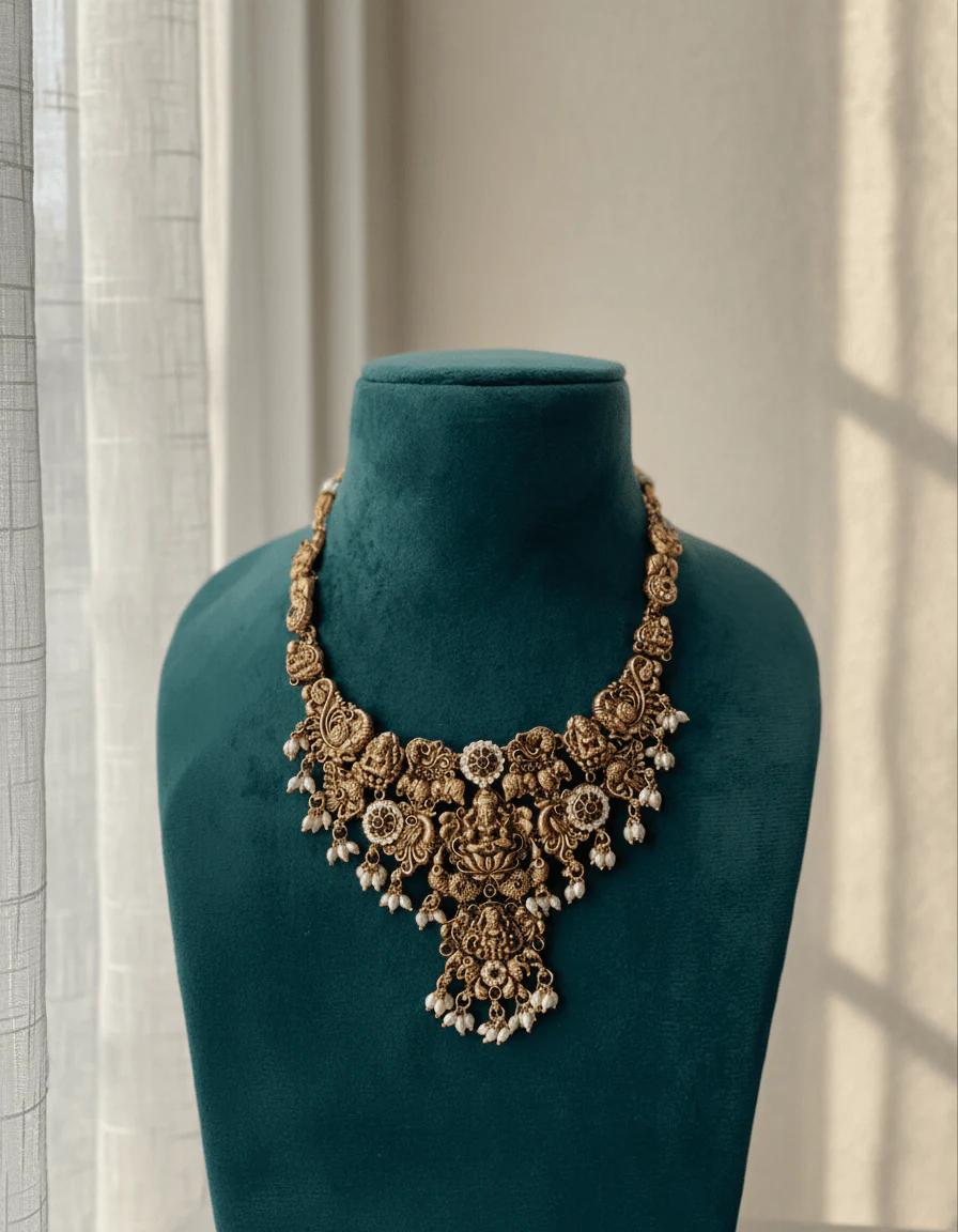Gold-Plated Temple Jewelry Set with Lakshmi Necklace and Jhumka Earrings – Antique Finish Ruby & Emerald Bridal Jewelry for Weddings & Festivals