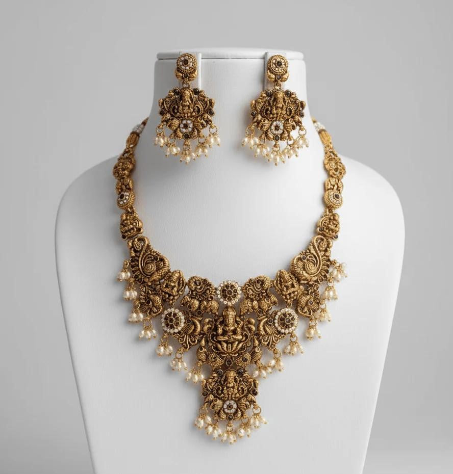 Gold-Plated Temple Jewelry Set with Lakshmi Necklace and Jhumka Earrings – Antique Finish Ruby & Emerald Bridal Jewelry for Weddings & Festivals