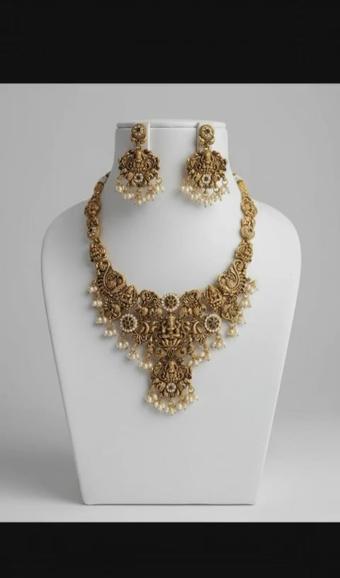 Gold-Plated Temple Jewelry Set with Lakshmi Necklace and Jhumka Earrings – Antique Finish Ruby & Emerald Bridal Jewelry for Weddings & Festivals